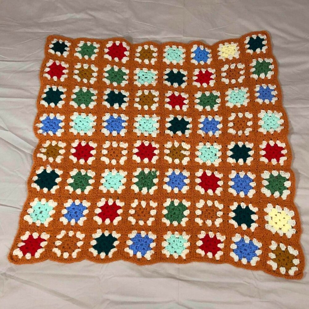 Vintage orange crochet afghan w/ multicolored granny core squares